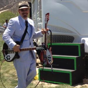 Sammy Busby of Dixies Deceivers and his Rickenbacker guitars head for the stage in Temecula California for the Rock the Country Festival