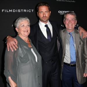Gerard Butler and his mother and father attend the Premiere of FilmDistricts Olympus Has Fallen at the ArcLight Cinemas Cinerama Dome on March 18 2013 in Hollywood California