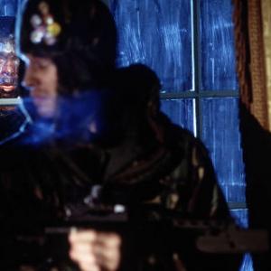 Marvin Campbell is the infected peering through the window at Luke Mably (front).