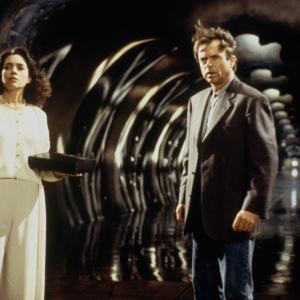 Still of Sam Neill and Julie Carmen in In the Mouth of Madness 1994