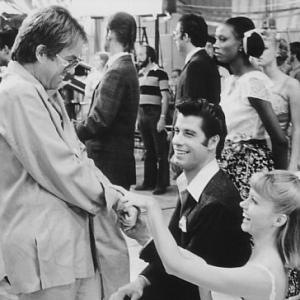 Still of John Travolta Olivia NewtonJohn and Allan Carr in Grease 1978