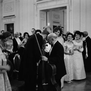 Pablo Casals whispering to John F Kennedy on the night he performed at the White House Jacqueline Kennedy on right