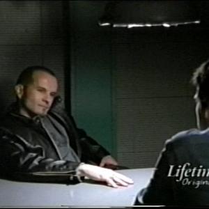 Ian Paul Cassidy as Gavin and Jon Hamm as Inspector Nate Basso on Lifetimes The Division