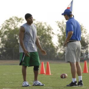Still of Kyle Chandler and Gaius Charles in Friday Night Lights 2006