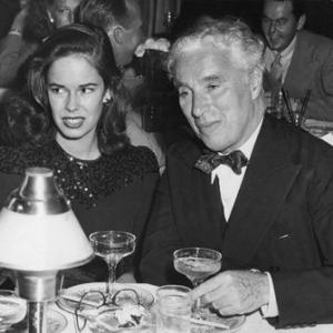 Charlie Chaplin with wife Oona ONeill at their first public appearance at the Mocamba