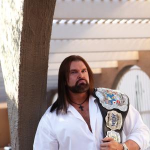 Bryan E Clark II with championship belt