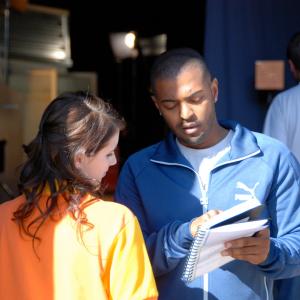 Noel Clarke giving notes to Emma Roberts on the set of 4321