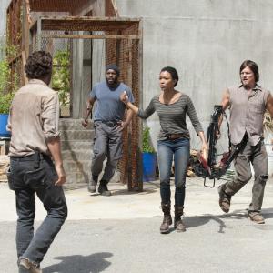 Still of Norman Reedus Chad L Coleman Rick Grimes Andrew Lincoln and Sonequa MartinGreen in Vaiksciojantys negyveliai 2010