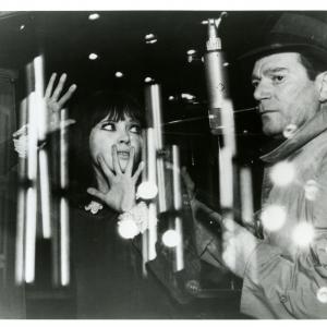 Still of Eddie Constantine and Anna Karina in Alphaville, une étrange aventure de Lemmy Caution (1965)