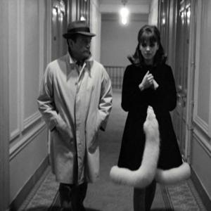 Still of Eddie Constantine and Anna Karina in Alphaville, une étrange aventure de Lemmy Caution (1965)