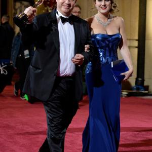 Neil Corbould, winner of Best Achievement in Visual Effects and Maria Pudlowska leave the Oscars at Hollywood & Highland Center on March 2, 2014 in Hollywood, California.