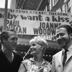 Paul Newman Joanne Woodward and James Costigan in front of the marquee for Baby Want a Kiss