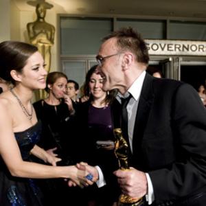 Winning the category Achievement in directing for work on Slumdog Millionaire Fox Searchlight Danny Boyle meets Oscar winning actress Marion Cotillard outside the Governors Ball with the Oscar at the 81st Annual Academy Awards from the Kodak Theatre in Hollywood CA Sunday February 22 2009
