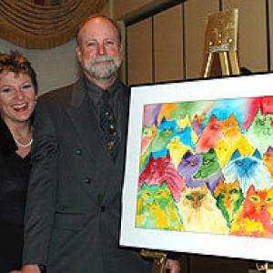 Kim Crow and her husband artist Drew Strouble with one of his paintings for the Opera for Animals fundraiser for OASIS Sarasota FL 32006
