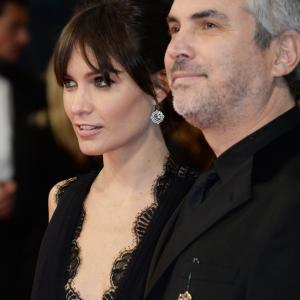 Sheherazade Goldsmith L and Alfonso Cuaron attend the EE British Academy Film Awards 2014 at The Royal Opera House on February 16 2014 in London England