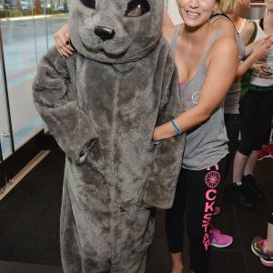 Actress Kaley Cuoco poses with Sammy the Seal at the launch of Wheels for Seals benefiting The Humane Society Of The United States at Soul Cycle Beverly Hills on June 23, 2014 in Beverly Hills, California.