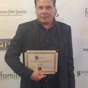 Frank holding Best Picture Award for Real Gangsters