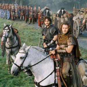 Arthur's Knights of the Round Table, including Galahad (Hugh Dancy, center) and Gawain (Joel Edgerton, right) stand ready to protect the traveling caravan.