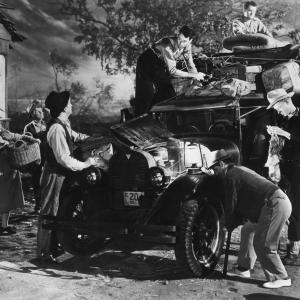 Still of Henry Fonda Dorris Bowdon Frank Darien Russell Simpson Frank Sully and OZ Whitehead in The Grapes of Wrath 1940