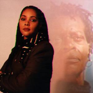 Director Julie Dash in frony of an image from her film Daughters of the Dust