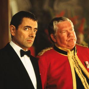 Still of Rowan Atkinson and Rowland Davies in Johnny English (2003)