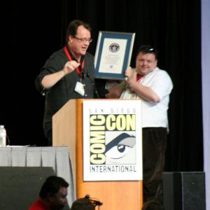 Producer Russell T Davies accepts an award from Guinness World Records representative Craig Glenday for the most successful SciFi TV series ever