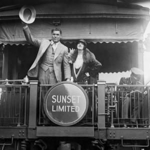 Jack Dempsey and Estelle Taylor at S.P. Station in Los Angeles as they head off to New York for his comeback fight 06-17-1927. From the Sheryl Deauville Collection.