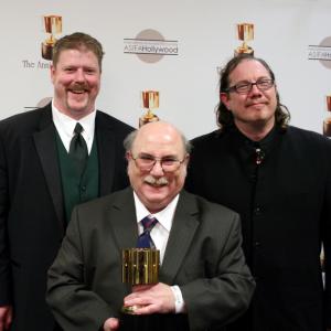 Feature character animation winner Eric Goldberg with presenters John DiMaggio and Fred Tatasciore
