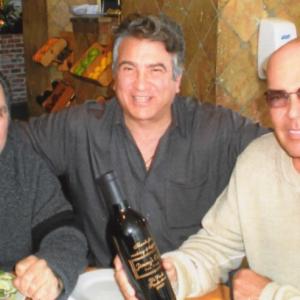 From left to right my friends actor David Provol from Sopranos fame me and Joe Isgro wellknown Music Promoter Film ProducerHis latest was Hoffa with Jack Nicholson Hes currently set to produce The Luciano Story and Escobar Joe is holding a bottle of wine on which I had engraved the title and words commemorating the short I wrote and directed Jimmys Cafe