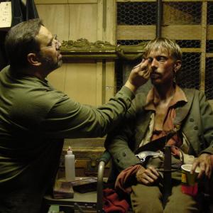 Ken Diaz applies final touches to Mackenzie Crook as Ragetti in Pirates of the Caribbean The Curse of the Black Pearl