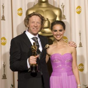 For Achievement in cinematography the Oscar goes to cinematographer Anthony Dod Mantle left posing with presenter Natalie Portman right for the work done on Slumdog Millionaire Fox Searchlight during the live ABC Television broadcast of the 81st Annual Academy Awards from the Kodak Theatre In Hollywood CA Sunday February 22 2009