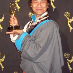 Tsering Dorjee bawa hold a Emmy Award