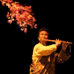 Tsering Dorjee bawa playing flute for world peace