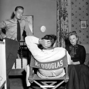 June Allyson and Alan Ladd with Dir. Gordon Douglas on the set of 