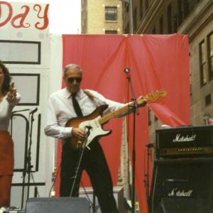 Playing his Stratocaster guitar and Marshall Amp at a Bastille Day Street Party in Manhattan
