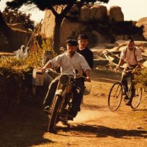 Dominique Pinon (on the motorbike, in front) stars as Sylvain, Jean-Paul Rouve (on the motorbike, behind) stars as The Postman and Albert Dupontel (on the bicycle) stars as Célestin Poux.