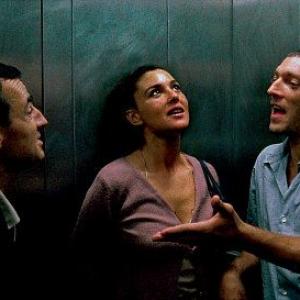 Albert Dupontel as Pierre, Monica Bellucci as Alex, and Vincent Cassel as Marcus in the Gaspar Noé film IRREVERSIBLE.
