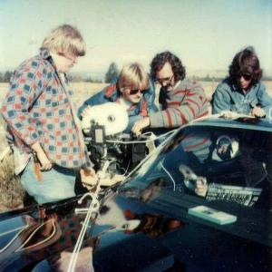 Gordon Merrick, Douglas Craik, Andrew Jaremko, Donald D. Brown, Stan Edmonds (in car). Filming SEQUENCE, August 12, 1979. West of Cochrane, Alberta.