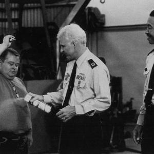 Eric Edwards as Pvt. Doberman, Steve Martin as Sgt. Bilko, and John Marshal Jones