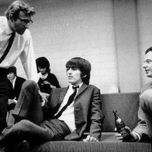 George Harrison with manager Brian Epstein c 1964
