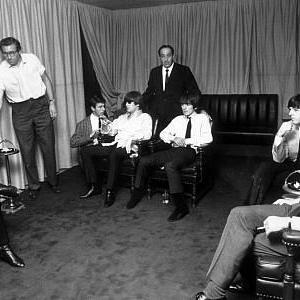 The Beatles (Ringo Starr, John Lennon, George Harrison, & Paul McCartney with manager B. Epstein) c. 1964
