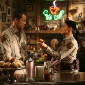 Still of Colin Ferguson and Erica Cerra in Eureka 2006