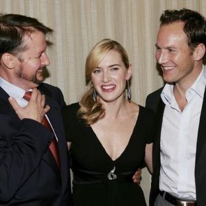 NEW YORK  SEPTEMBER 30 HOLLYWOOD REPORTER AND US  LR Director Todd Field chats with actors Kate Winslet and Patrick Wilson at a prepremiere New York Film Festival dinner for the film Little Children at Porterhouse September 30 2006