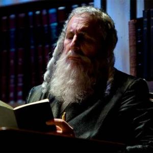 Corey Fischer as Rabbi Saunders in 