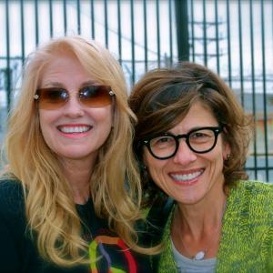 Mo Fitzgibbon and Nina Tassler on the set of Lets Save the Children music video