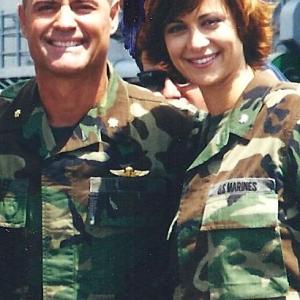 On the set of J.A.G., actors Jim Fitzpatrick and Catherine Belle, shoot scenes aboard a Desert Storm Battleship in, anchored in San Diego, in 1997