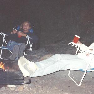 LR Cameron Diaz and Jodi Knotts relaxing by the fire on the Kern River in 1992