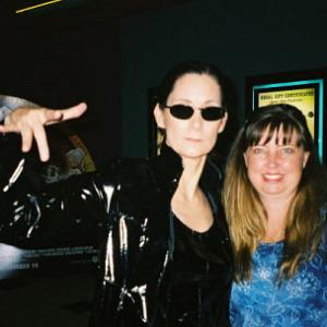Deborah Smith Ford as MATRIXS Trinity lookalike posing with a fan Lisa Wild at the Looney Tunes premiere