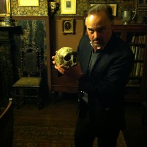 The Edwin Booth Room at The Players in NYC holding the skull that Booth used in Hamlet.