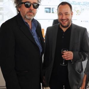 L to R Director Tim Burton and Producer Derek Frey attend a lunch hosted by Len Blavatnik Harvey Weinstein and Warner Music during the 66th Cannes Film Festival on board the Odessa at Old Port on May 19 2013